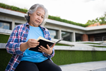 Native American on campus reading a book