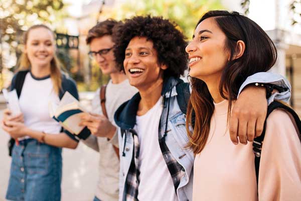 Group of diverse college students outside on campus