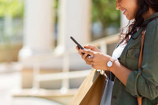 Woman texting outside