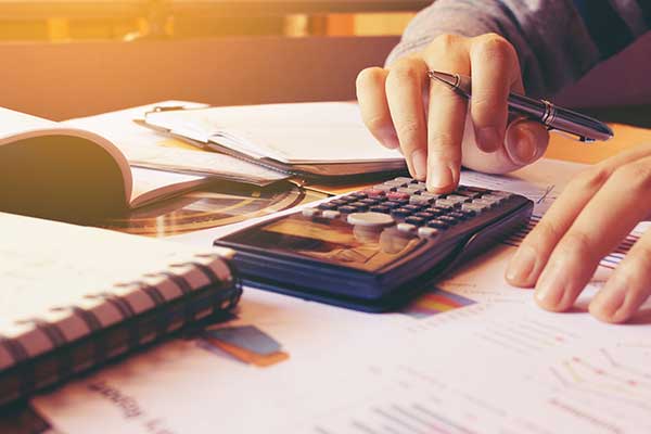 Hands with papers and calculator