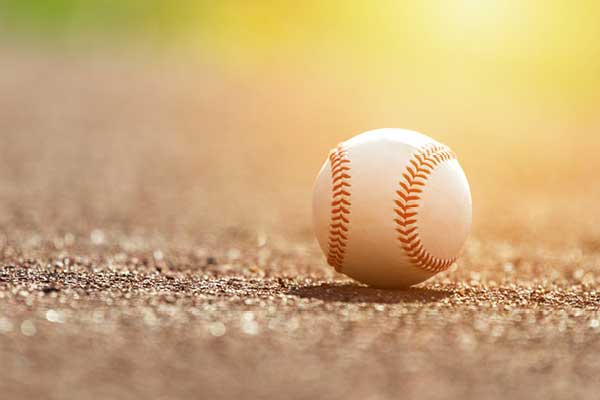 Baseball on pavement