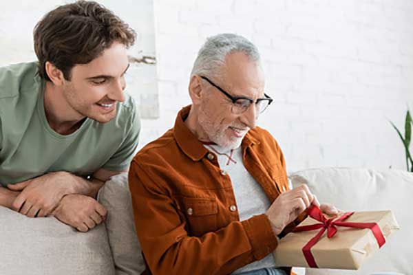 Son giving father a gift