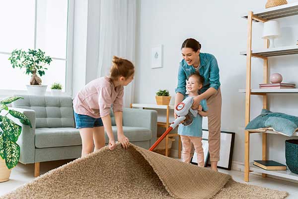 Daughters helping mom spring clean