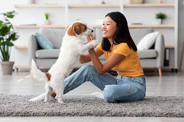 Woman playing with her dog