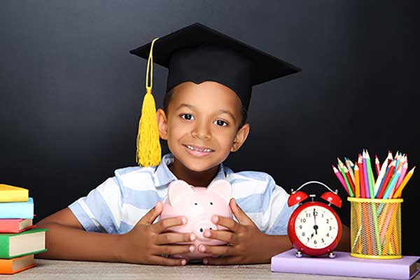 Young boy with graduation hat