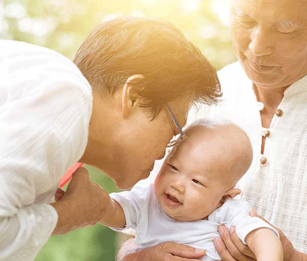 Asian gradma and gradpa with grandbaby