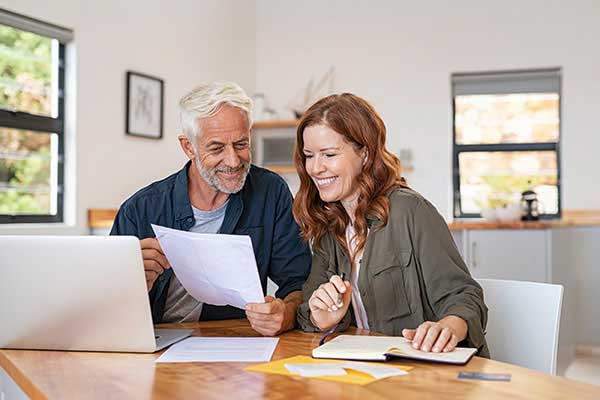 Agent and educator looking over retirement plan