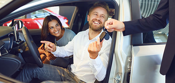 Couple buying a new car